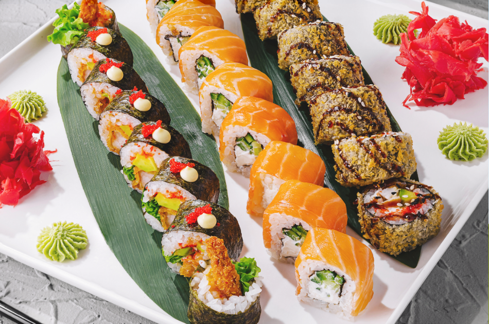 Assorted sushi rolls and salmon rolls arranged on a platter, representing dining expenses and lifestyle spending in a family budget after having a baby